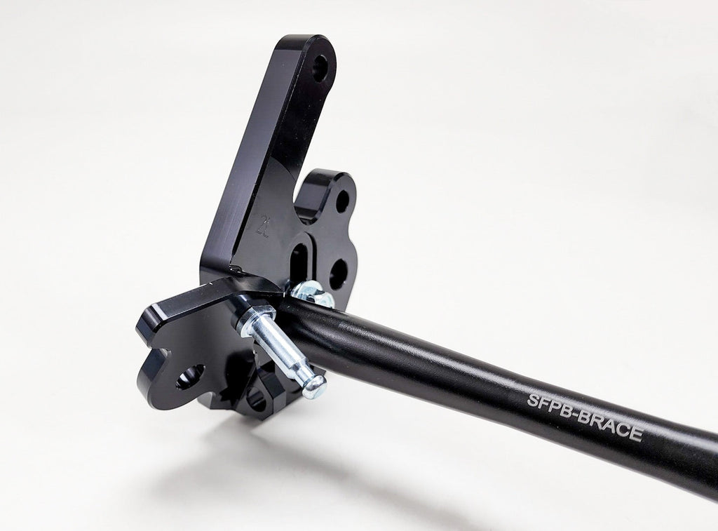 Modded Moto Co Warp 9 Talaria adjustable foot peg mount for motorcycle, showing the sturdy metal construction and mounting mechanism.