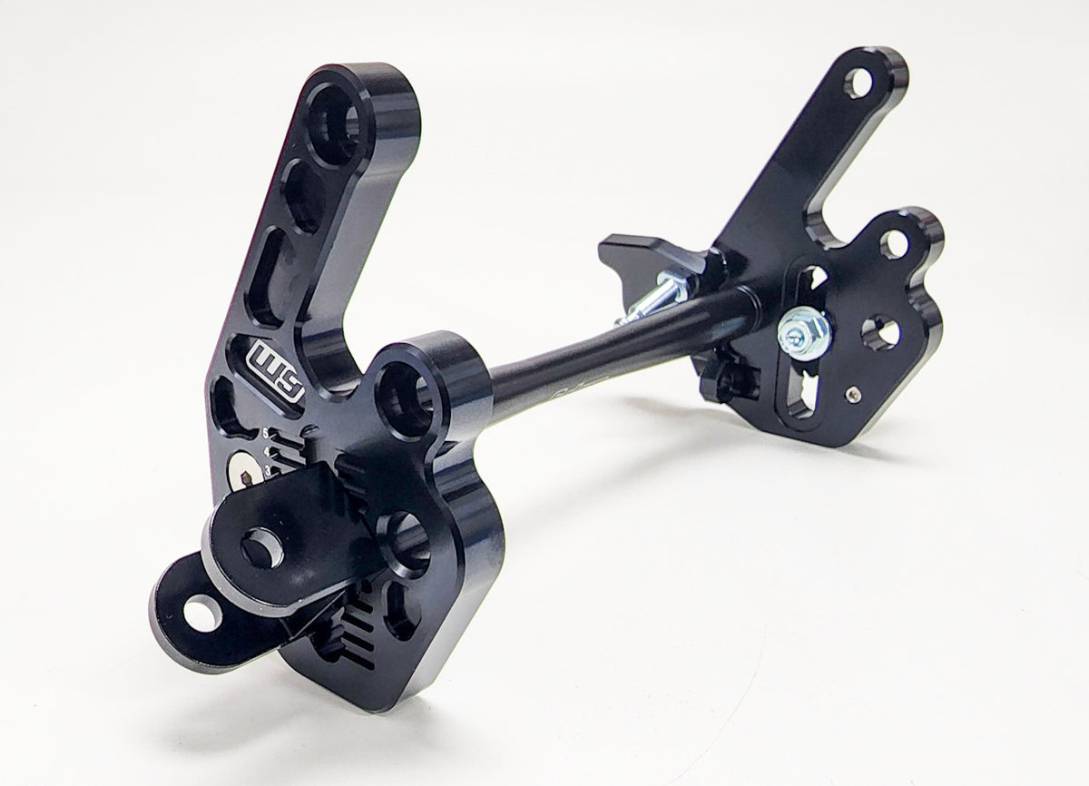 Modded Moto Co Warp 9 Talaria adjustable foot peg mount for motorcycle, showing the sturdy metal construction and mounting mechanism.
