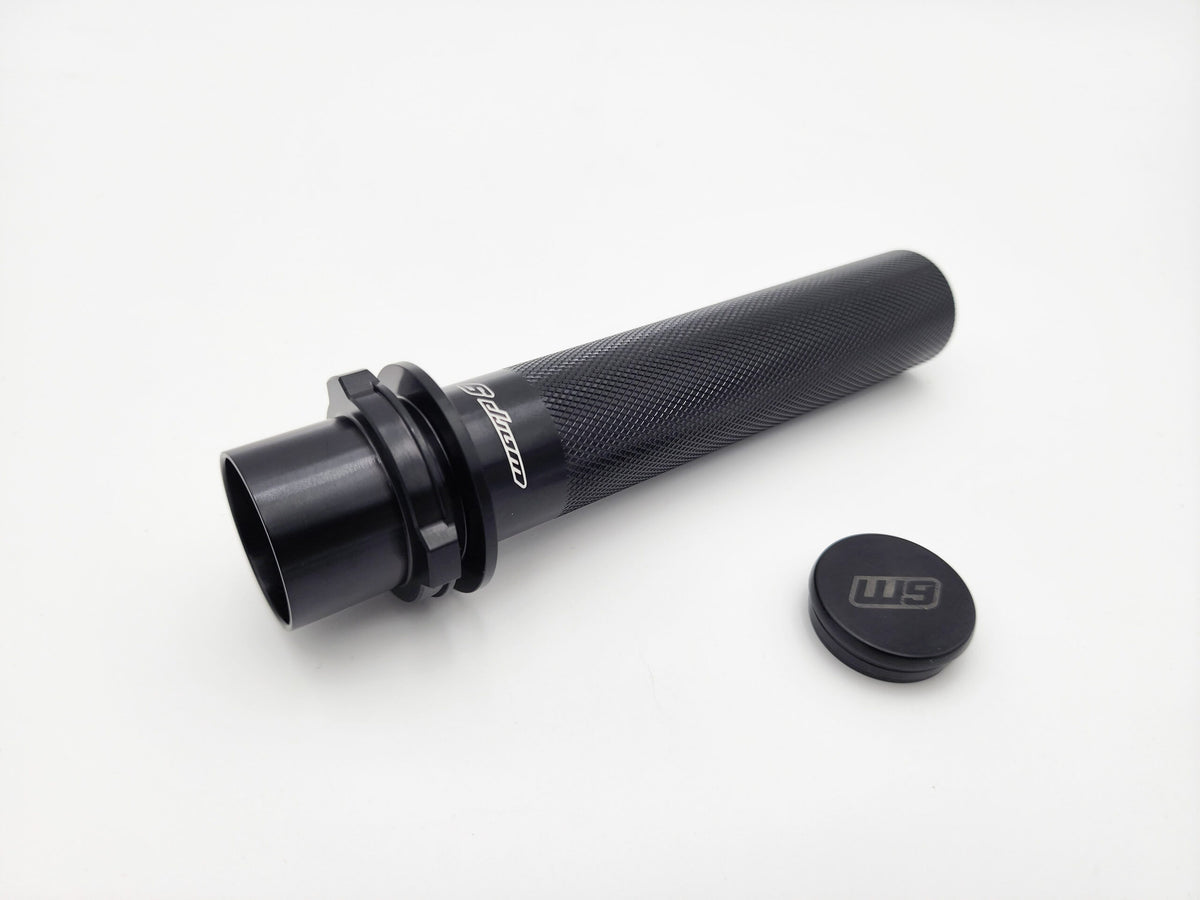 Warp 9 Surron Ultra Bee handlebar throttle tube by Modded Moto Co, showing close-up of black handlebar component.