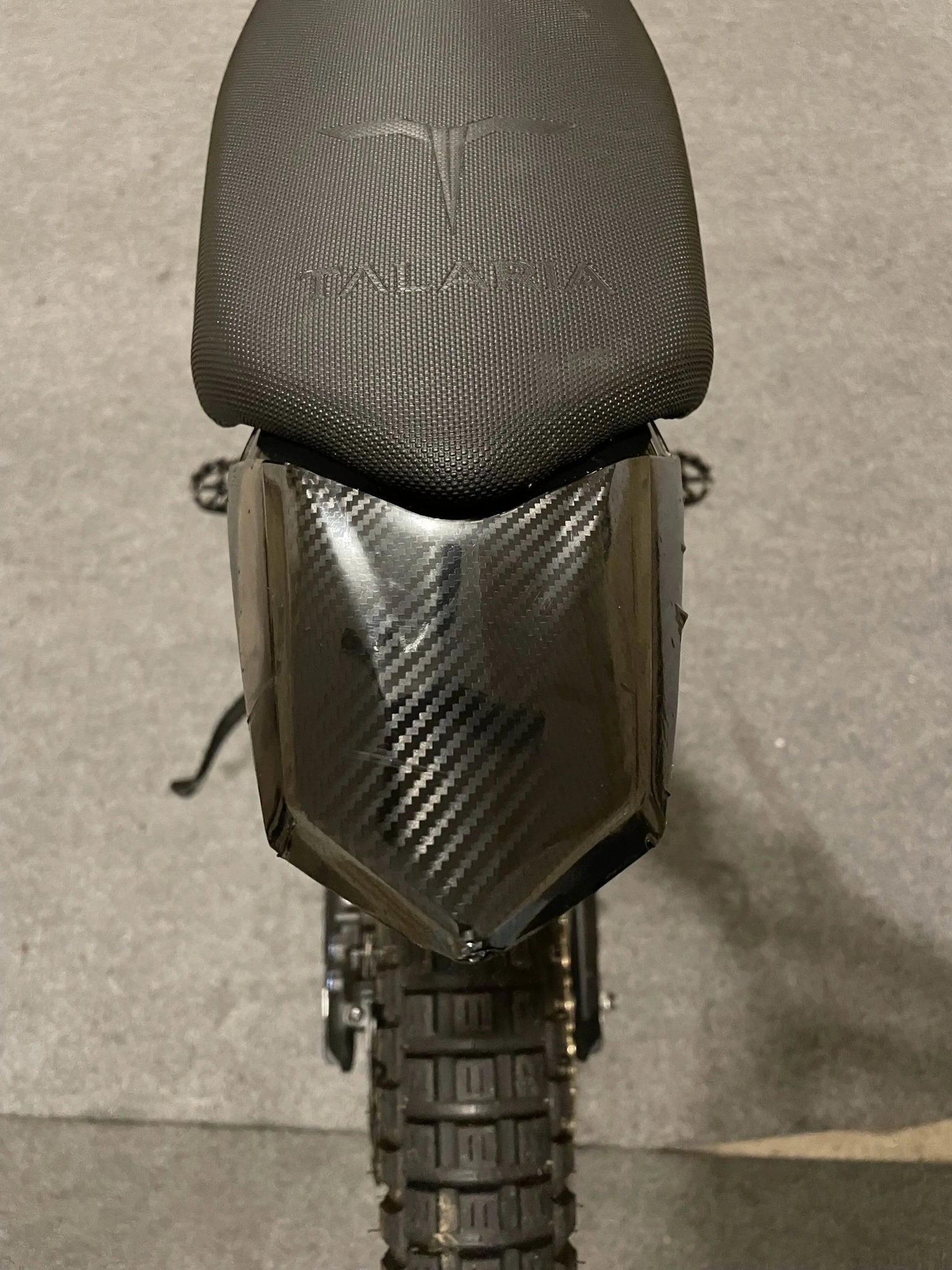 Black carbon fiber vinyl wrap kit for Talaria MX3 and MX4 bikes by MXwraps, shown in the image.