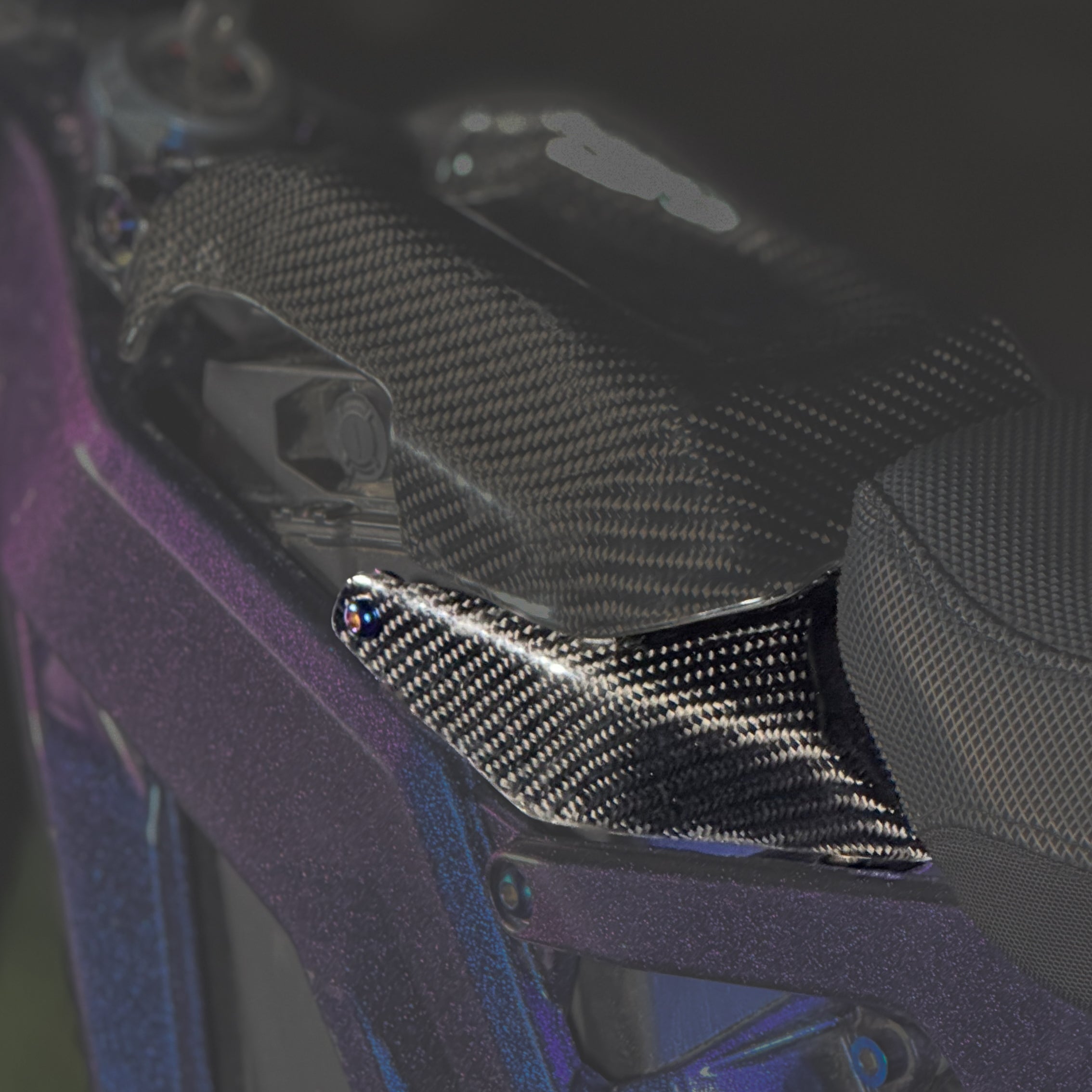 Modded Moto Co E-Ride Pro Carbon Fiber Battery Lid Lock for e-bike, showcasing sleek carbon fiber design and secure locking mechanism.