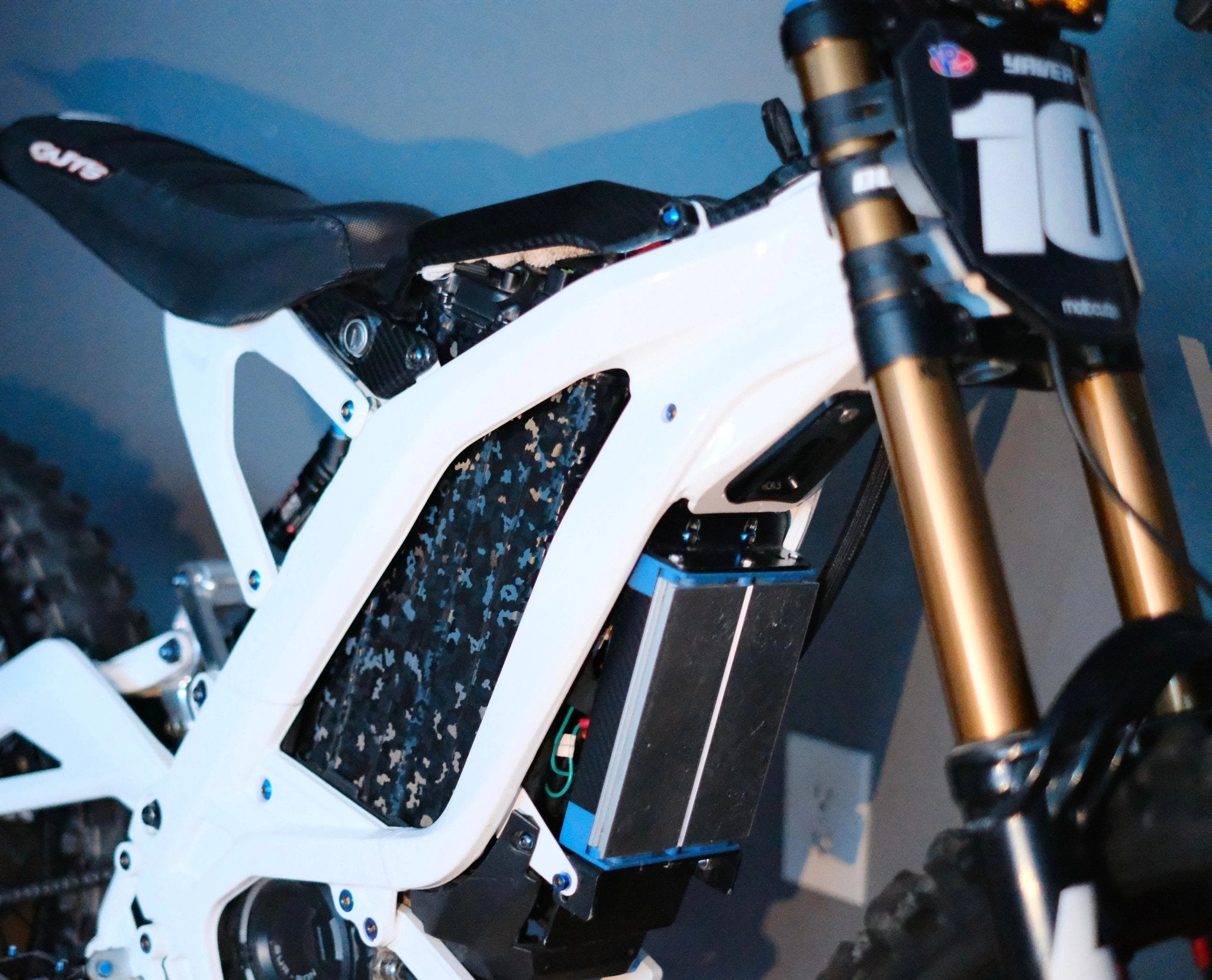 Black camouflage vinyl wrap for MXwraps E-Bike ShadowSlate battery, showcasing the textured camouflage pattern on the battery surface.
