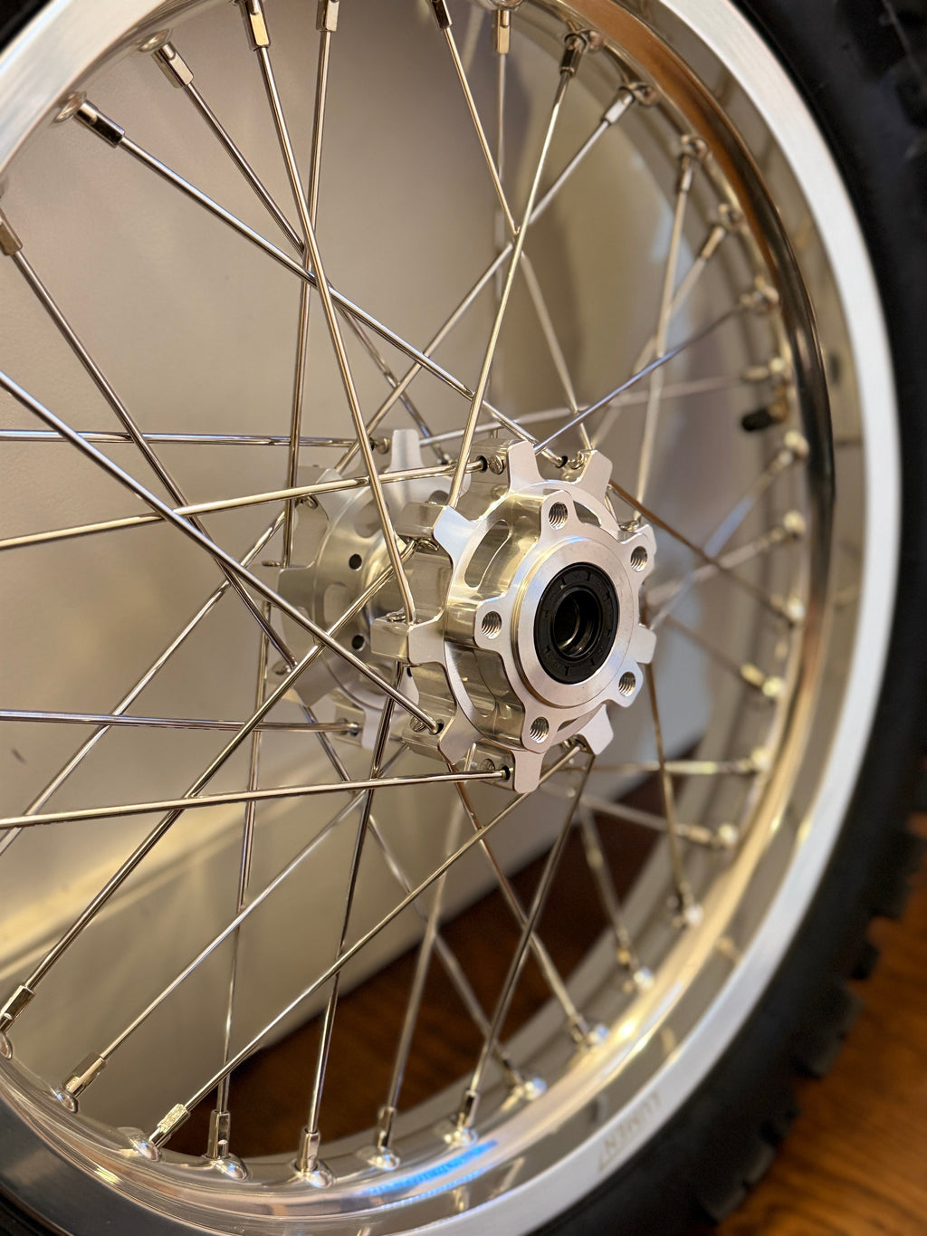 Lumen Racing 16/19 Light Bee/Eride Pro wheelset with preinstalled dirt tires on a bicycle wheel, ready for off-road riding.