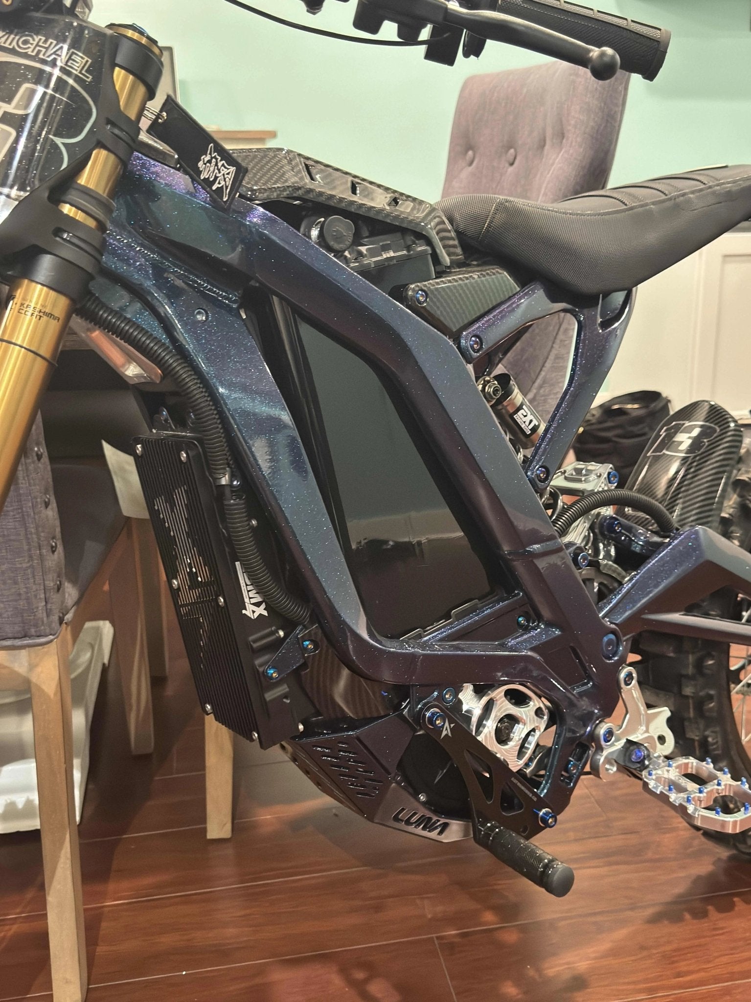 MXwraps Vantablack battery vinyl wrap on e-bike battery, showcasing a sleek, invisible black protective covering.