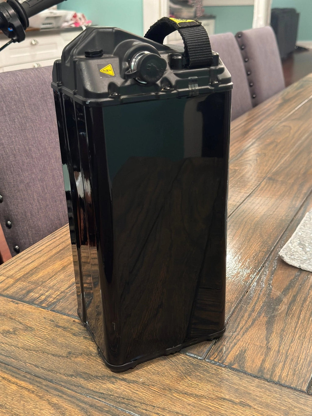 Black Vantablack battery vinyl wrap for e-bike from MXwraps, showing sleek, seamless design on the battery area.