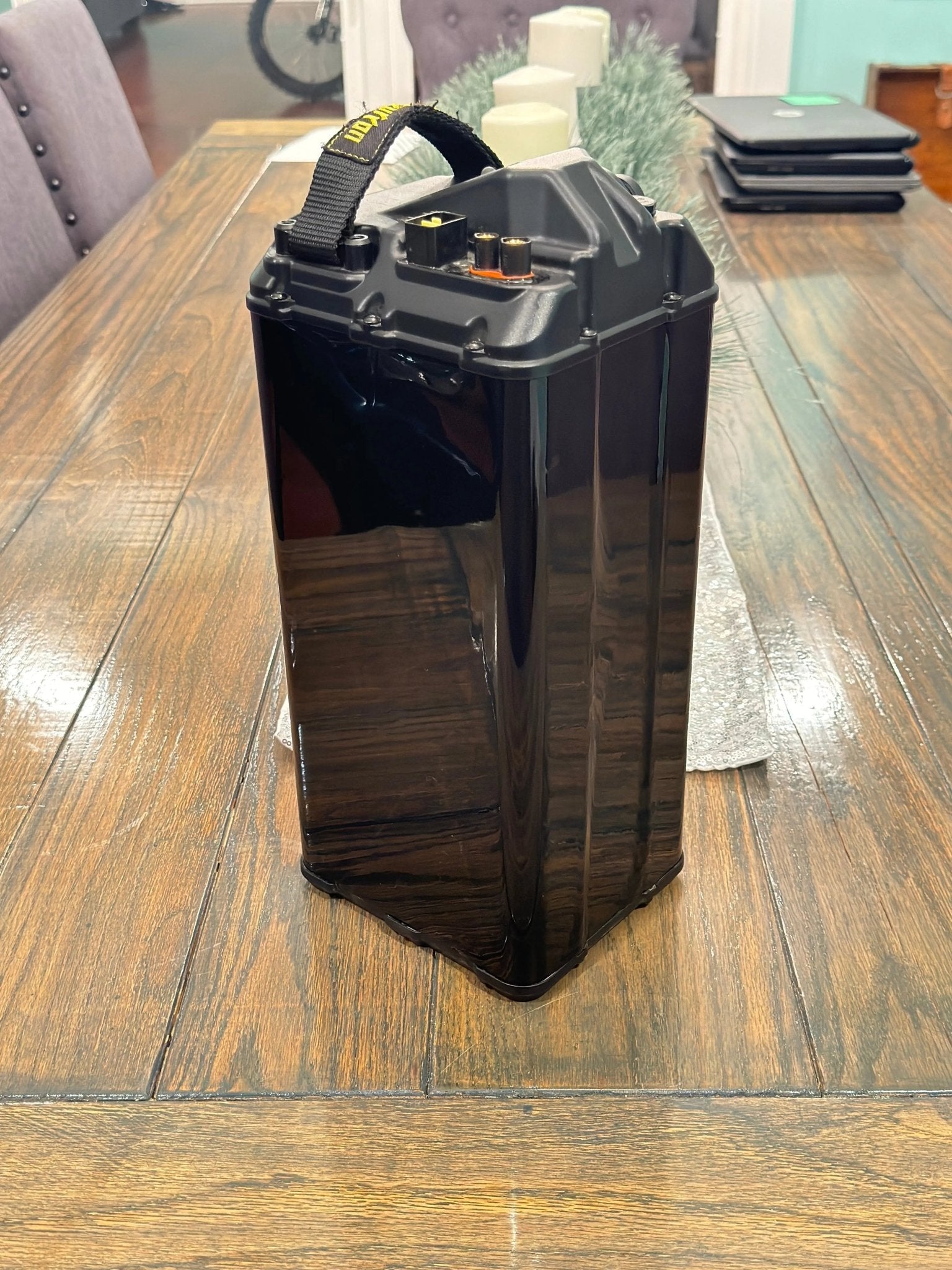 Black Vantablack battery vinyl wrap for e-bike from MXwraps, showcasing a sleek, seamless finish on the battery area.