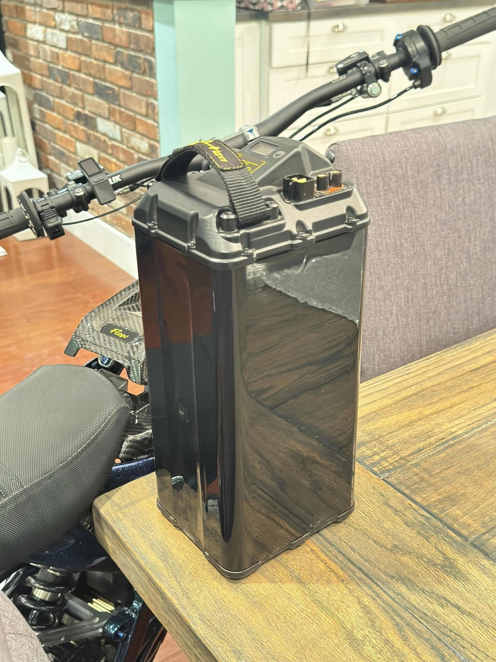 MXwraps Vantablack battery vinyl wrap for e-bike, featuring an "invisible" Vantablack finish on a sleek electric bike battery.