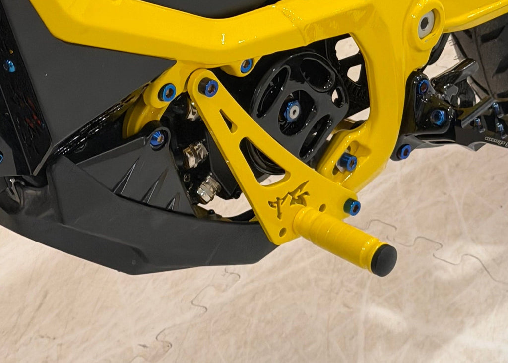 TG Racing Ultra Bee Shift Lock shown in black, designed to secure gear shifter and enhance racing vehicle safety.