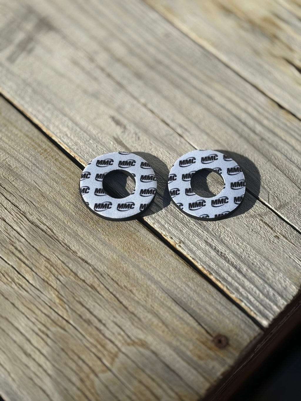 Modded Moto Co MMC Grip Donuts accessory with black rubber grips and silver accents, designed for motorcycle handlebar protection.