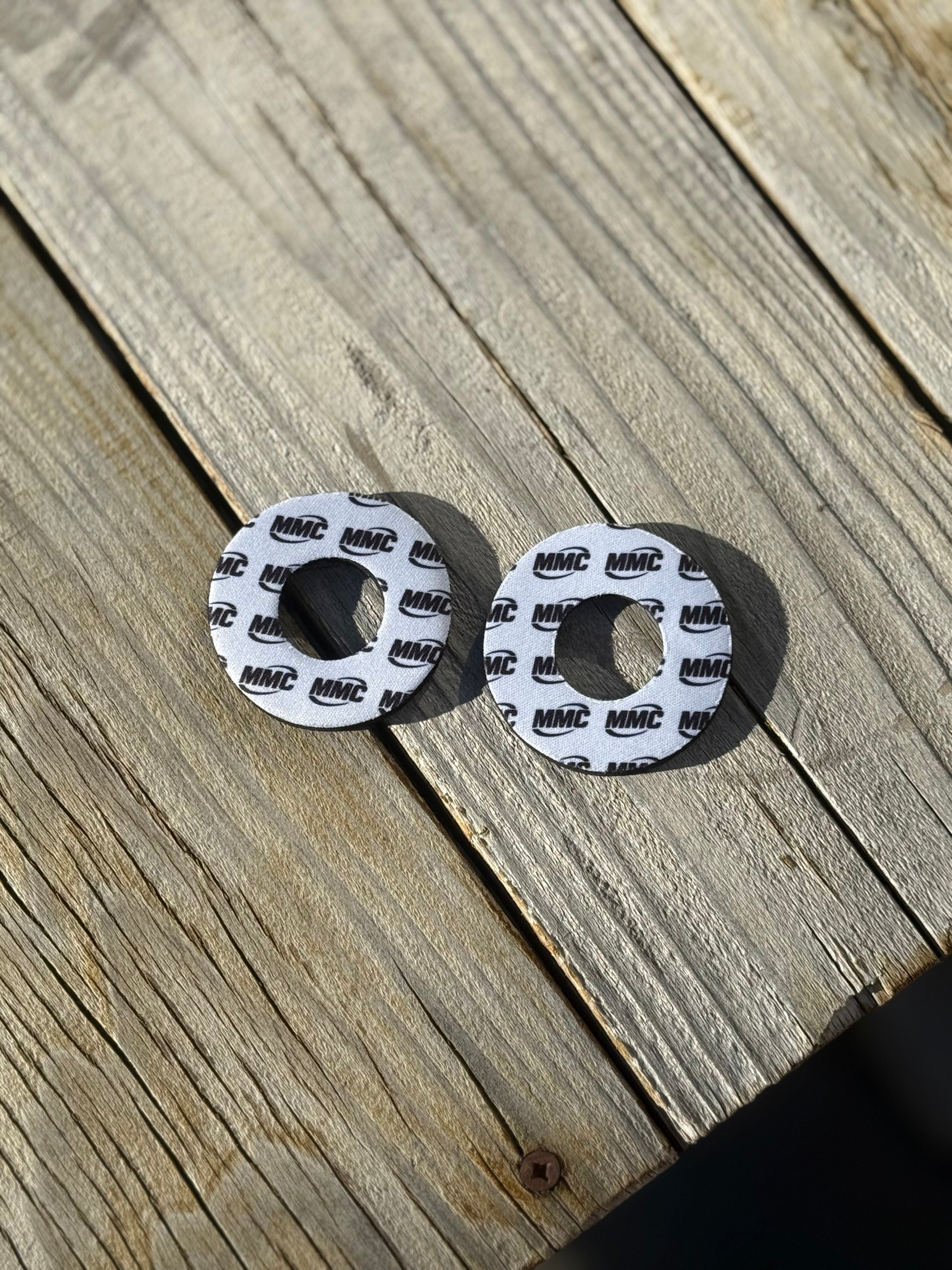 Modded Moto Co MMC Grip Donuts accessory with black rubber grip donuts on a motorcycle handlebar for improved grip.