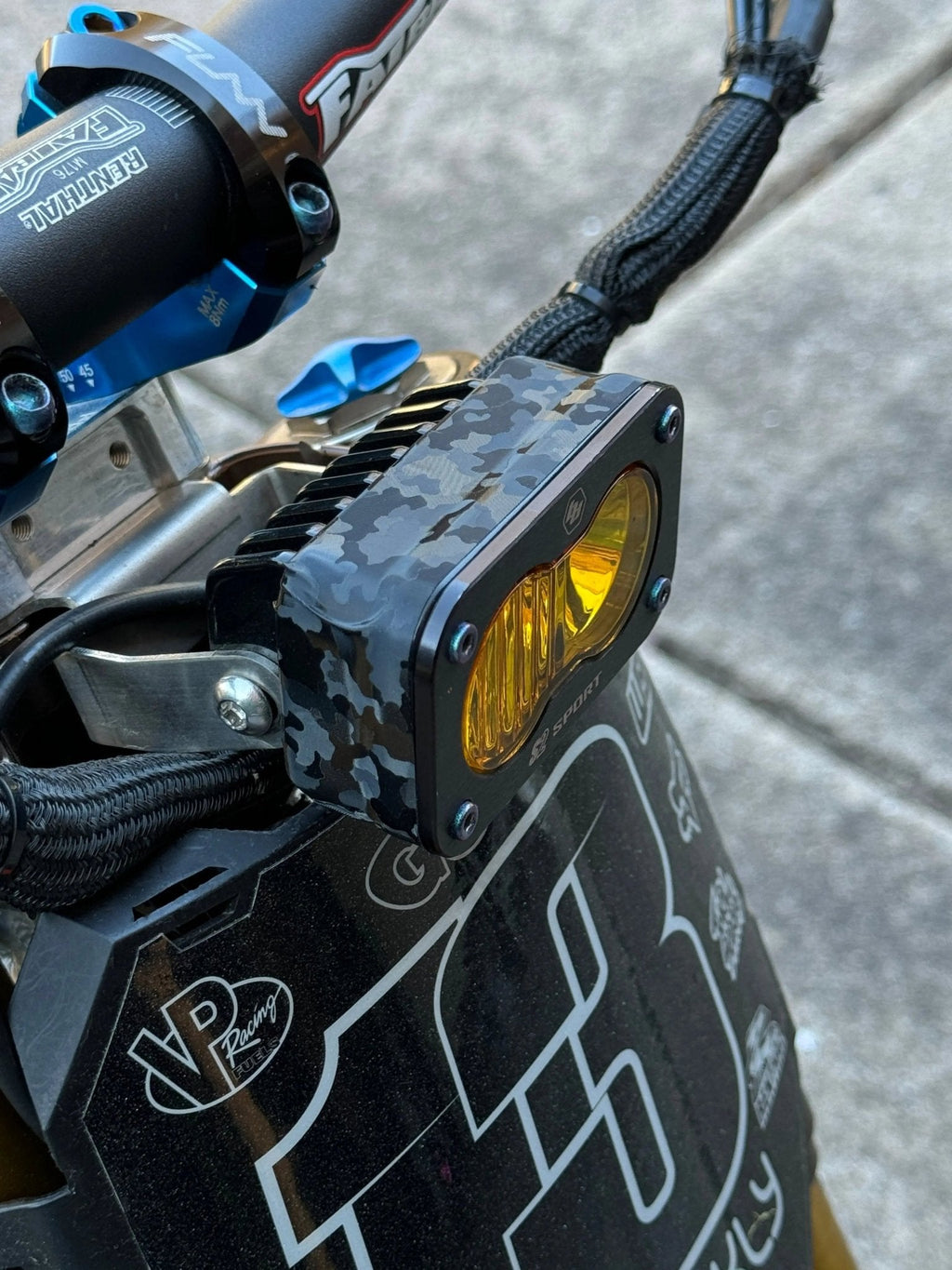 ShadowSlate Baja Style Headlight Wrap by MXwraps, vinyl wrap showing corner detail and textured finish for vehicle customization.