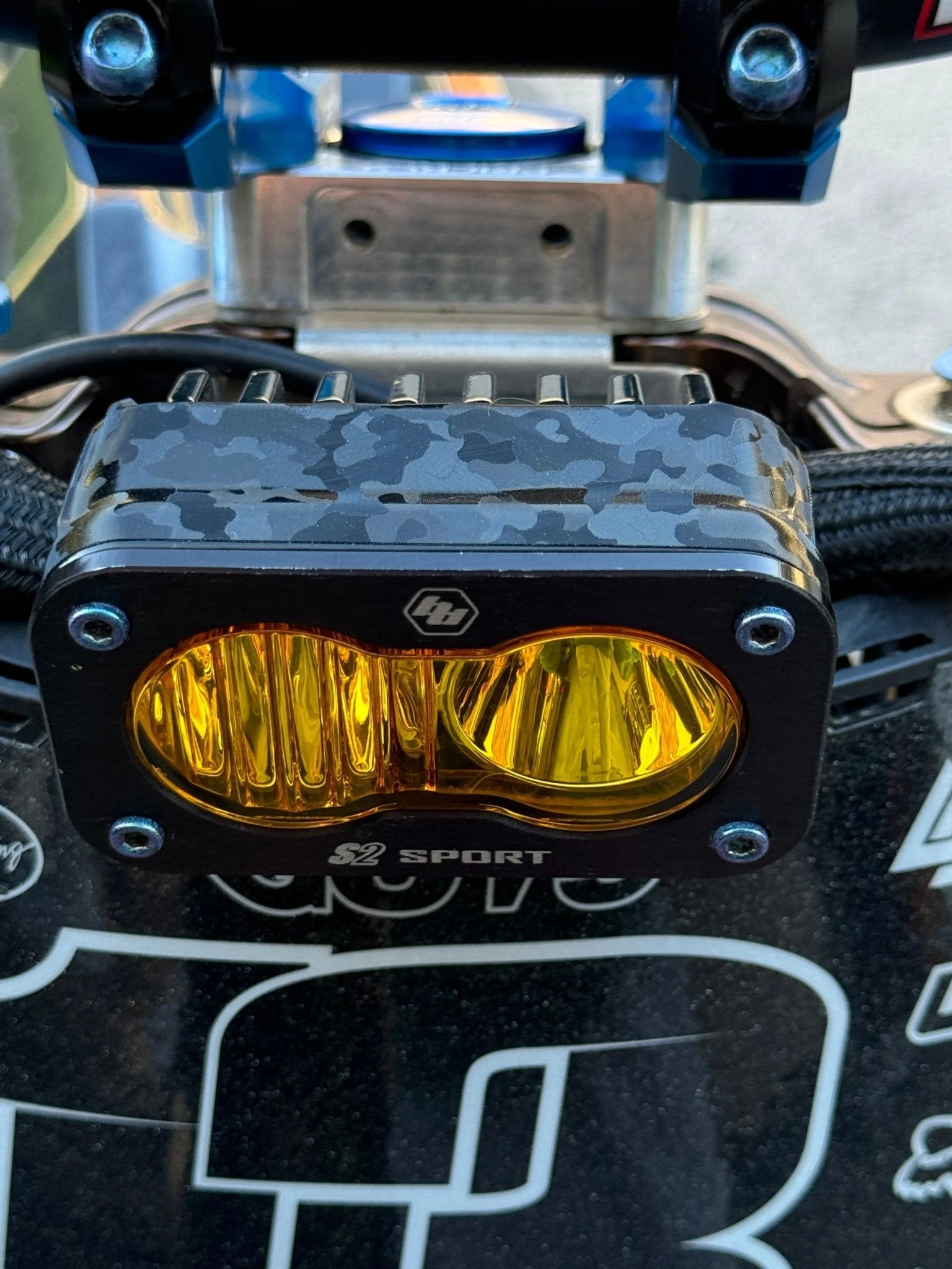 ShadowSlate Baja Style Headlight Vinyl Wrap by MXwraps on front of vehicle, showcasing durable, stylish automotive headlight protection.