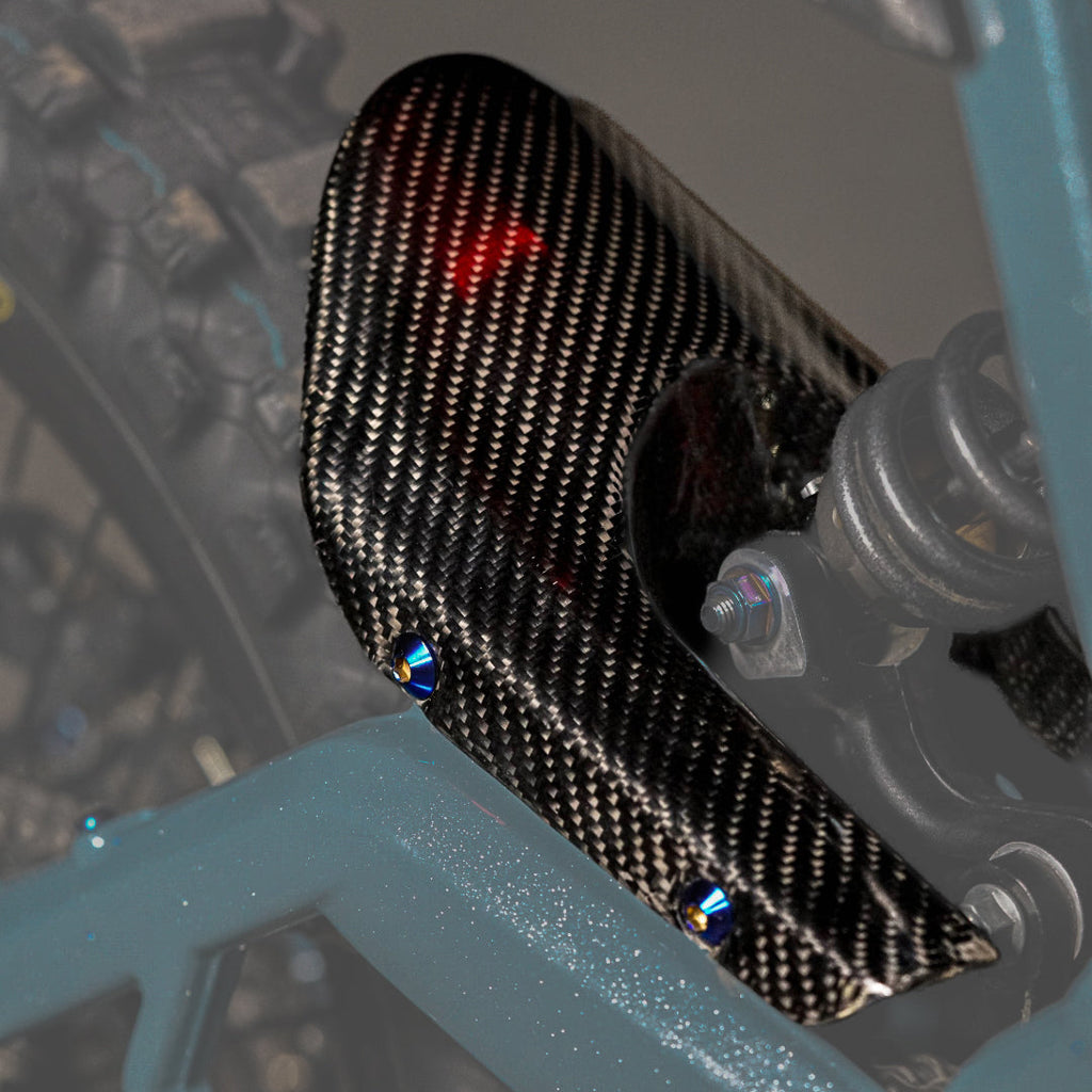 Modded Moto Co E-Ride Pro carbon fiber mud guard for electric bikes, showcasing sleek, lightweight body protection design.