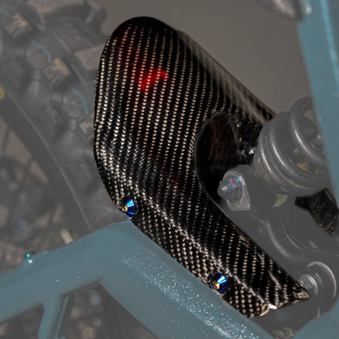 Modded Moto Co E-Ride Pro carbon fiber mud guard for electric bikes, showcasing sleek, lightweight body protection design.