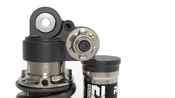 Modded Moto Co EXT Arma MX rear shock absorber for Surron and Talaria electric bikes, showcasing the shock and mounting hardware.
