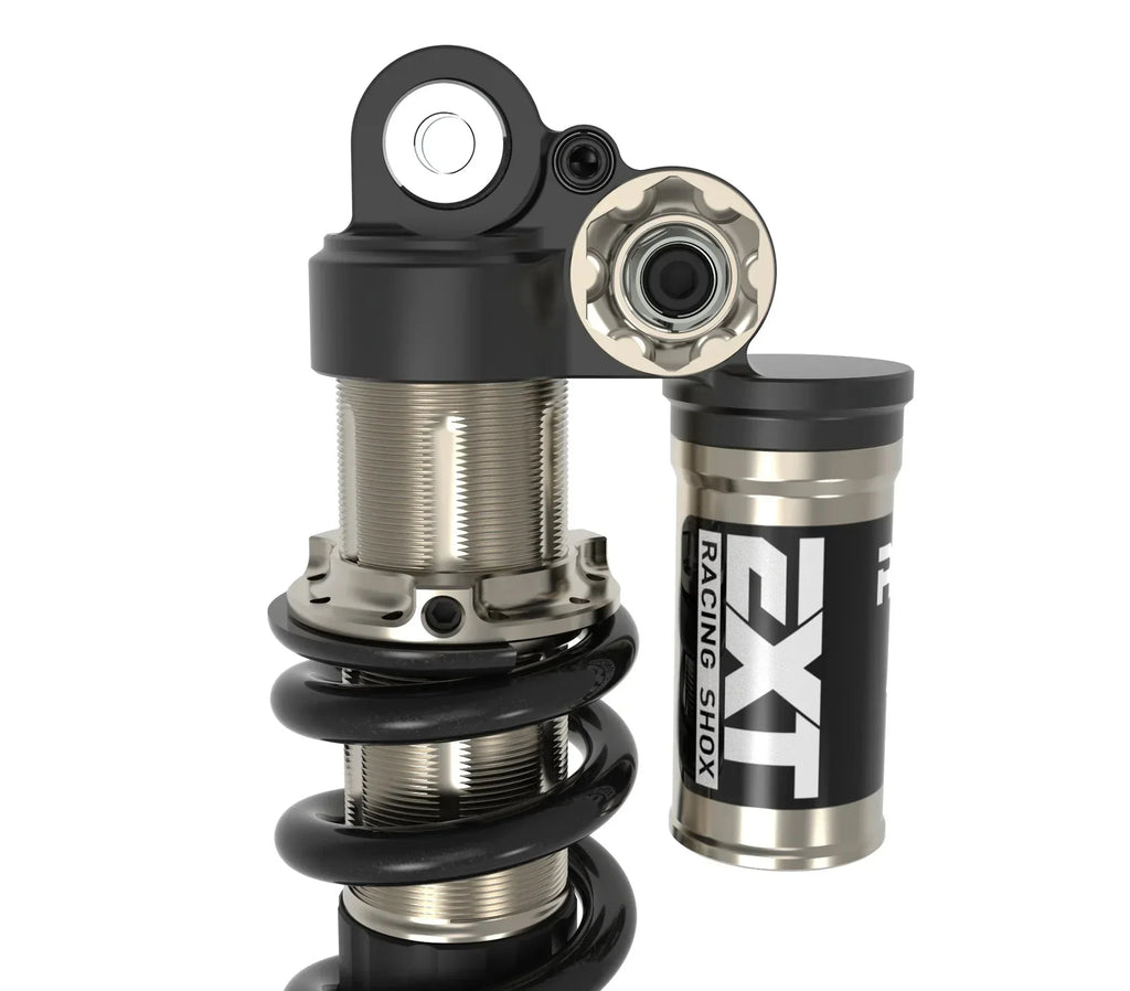 Modded Moto Co EXT Arma MX rear shock absorber for Surron and Talaria electric bikes, showcasing the shock's durable design and mounting points.