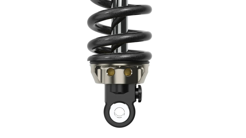Modded Moto Co EXT Arma MX rear shock absorber for Surron and Talaria electric dirt bikes, showcasing the shock's coil and mounting points.