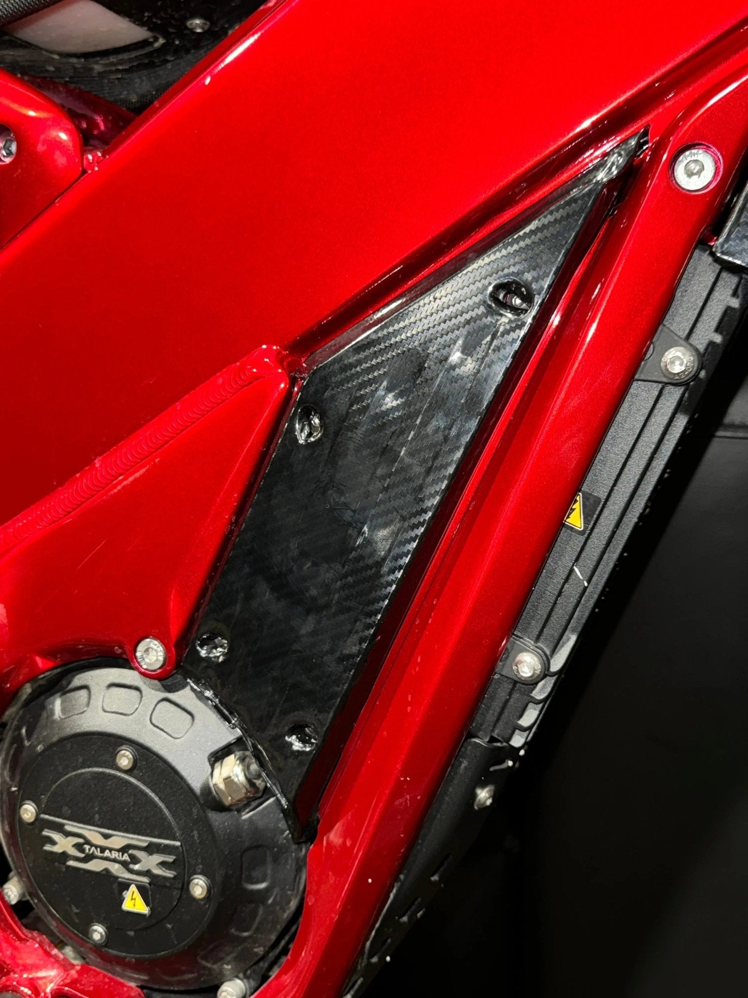 MXwraps Talaria XXX Carbon Fiber Wrap Kit vinyl wrap with textured carbon fiber design for vehicle customization.