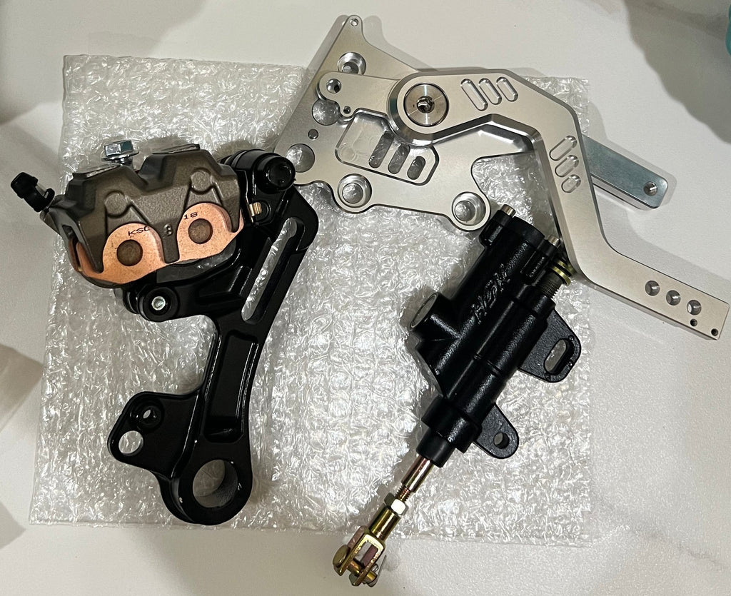 Emoto Flux Ultrasilverback Surron Light Bee/Eride pro moto foot brake kit installed on the motorcycle.