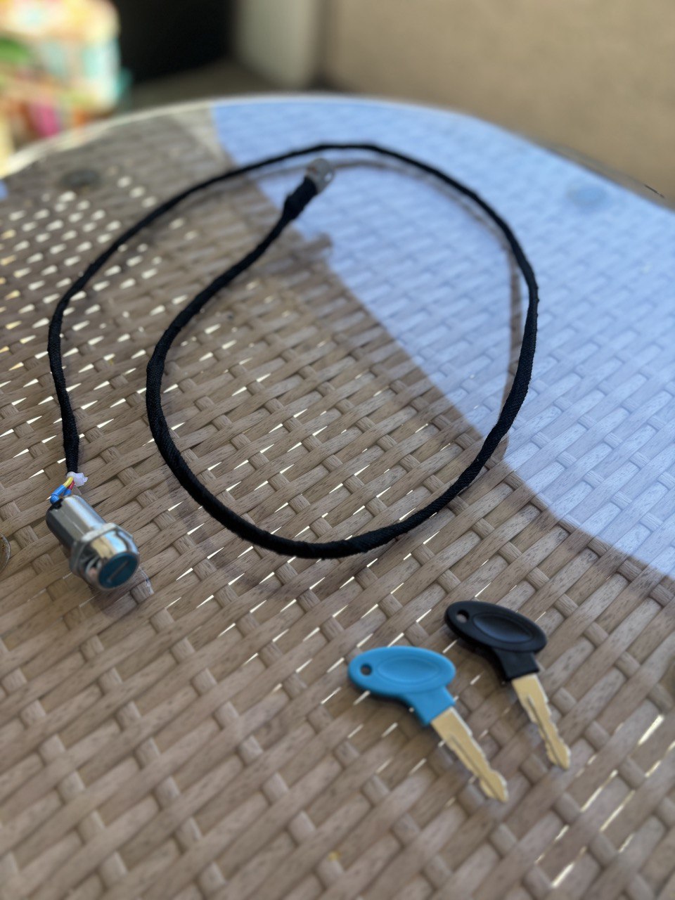 SouthRacing Talaria X3 plug and play key ignition with sleek design and easy installation, shown in a close-up view.