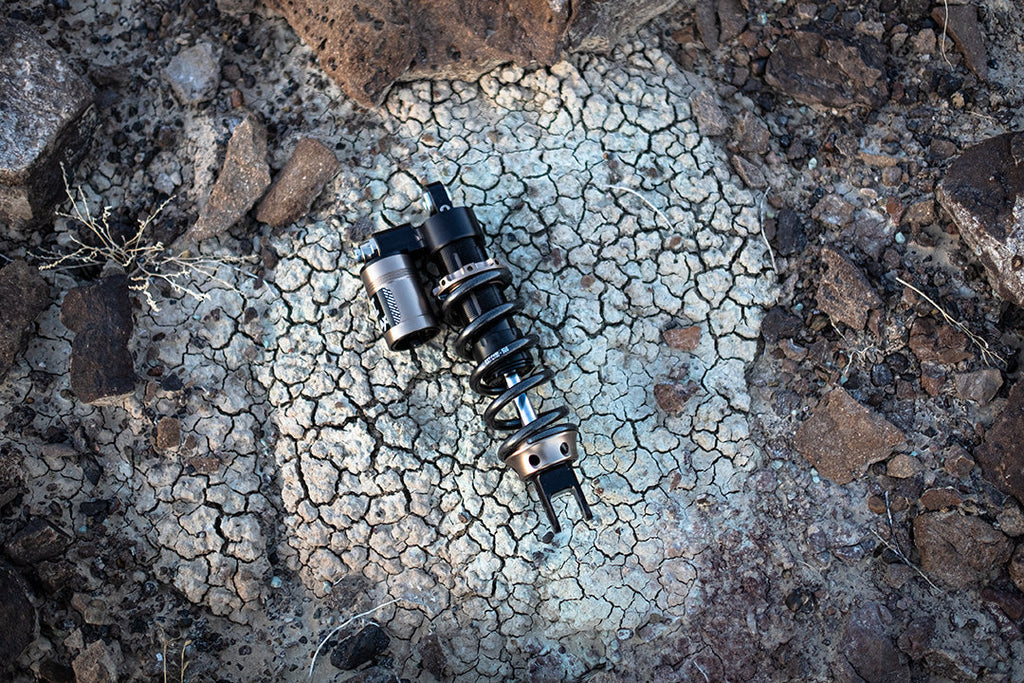 Modded Moto Co EXT REA MX Shock – Ultra Bee, whitecrack model with adjustable suspension for motocross bikes.