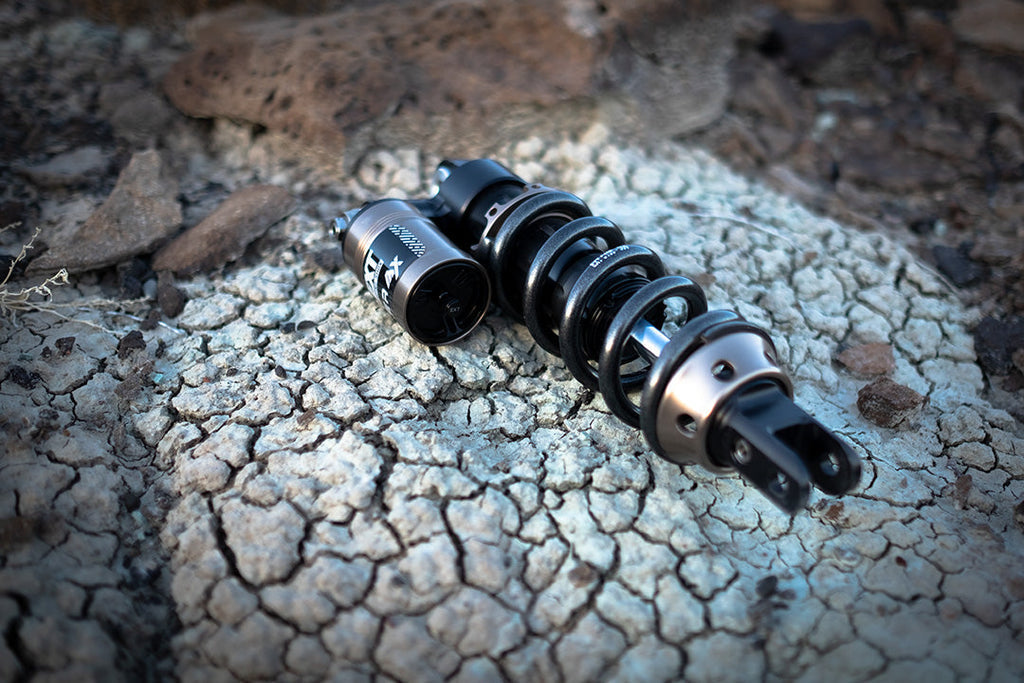 White Modded Moto Co EXT REA MX Shock – Ultra Bee for motocross bikes, showcasing the shock absorber's sleek design and white finish.
